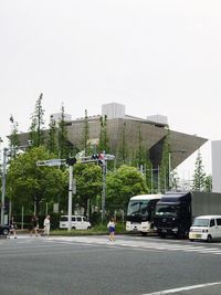 Cars on road against clear sky