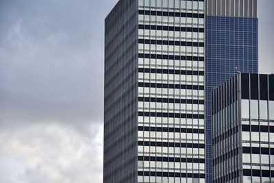Low angle view of office building against sky
