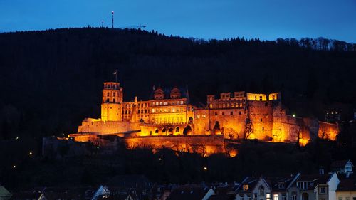 Illuminated heidelberg castle against sky at night