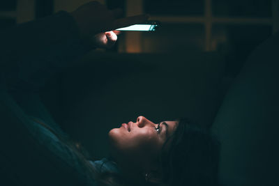 Low angle view of woman sitting at home