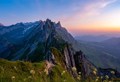 Scenic view of mountains against sky during sunset