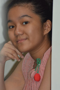 Close-up portrait of a smiling young woman