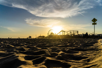 Scenic view of beach against sky during sunset