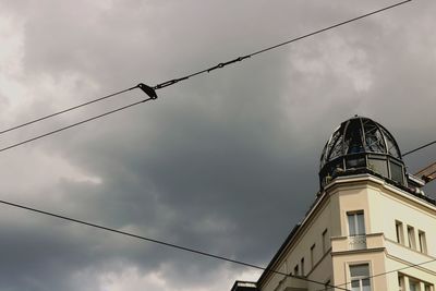 Low angle view of cables against sky