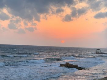 Scenic view of sea against sky during sunset