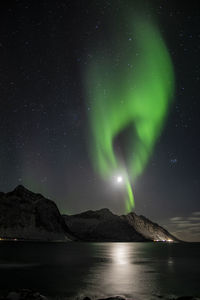 Scenic view of mountains against sky at night