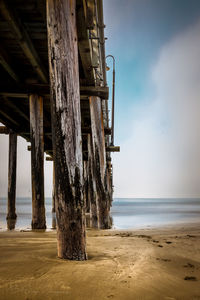 Pier over sea against sky