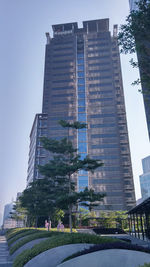 Low angle view of skyscraper against clear sky