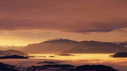 Scenic view of mountains against sky during sunset