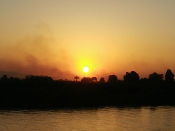 Scenic view of silhouette landscape against sky during sunset