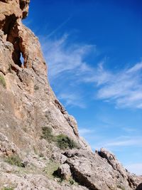 Low angle view of rock formation against sky