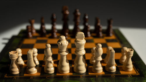 Close-up of chess pieces against white background