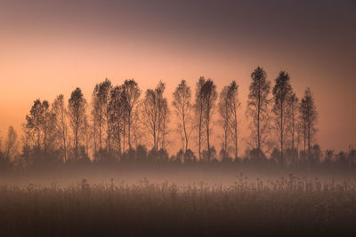 Scenic view of lake against sky during foggy weather