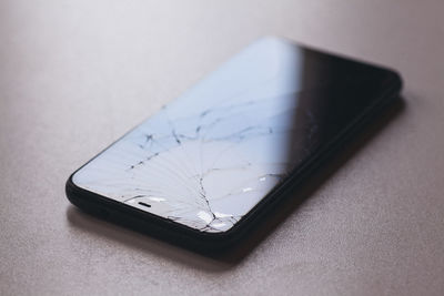 High angle view of mobile phone on table