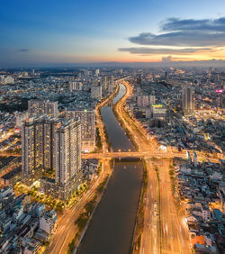 High angle view of illuminated city buildings at dusk