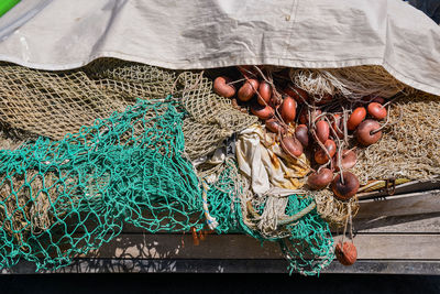 Close-up of fishing nets on a wooden platform of the harbor, liguria, italy