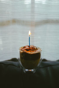 Close-up of tea light candles on table