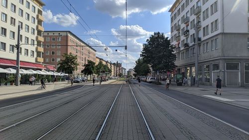 Street amidst buildings in city against sky