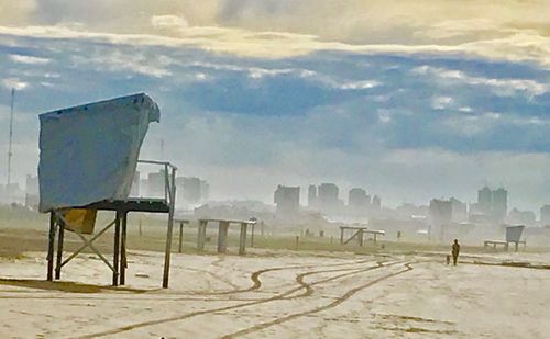 Scenic view of field against sky during winter