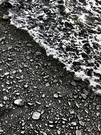 High angle view of pebbles on beach