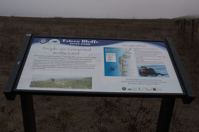 High angle view of information sign on field