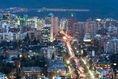 High angle view of illuminated city buildings at night