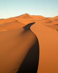 Scenic view of desert against clear sky