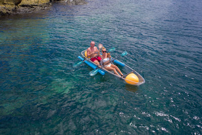 High angle view of people in boat at sea