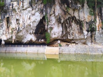 Reflection of rock in lake water