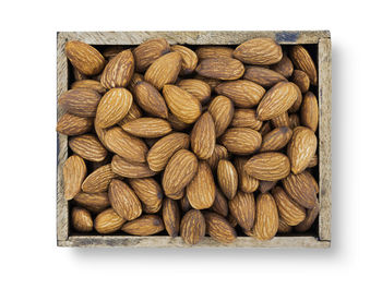 Directly above shot of roasted coffee beans on white background