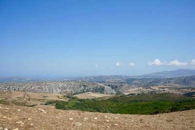 Scenic view of landscape against clear blue sky