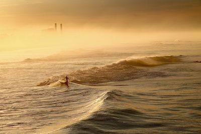 Scenic view of sea at sunset