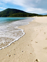 Scenic view of beach against sky