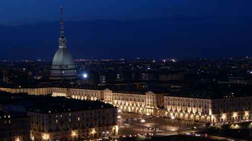 High angle view of illuminated buildings in city at night