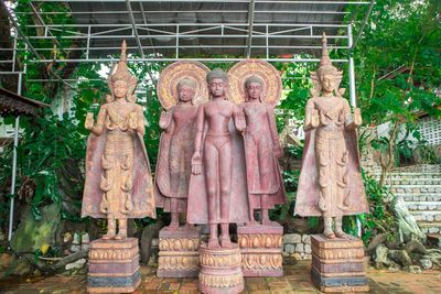 Statue of buddha against temple