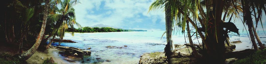 Scenic view of sea against cloudy sky