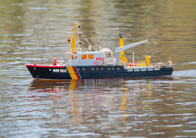 Remote controlled ship model is remote controlled on a lake