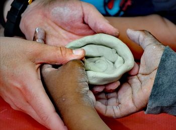 Close-up of people holding hands