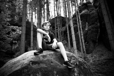 Portrait of woman sitting in a forest