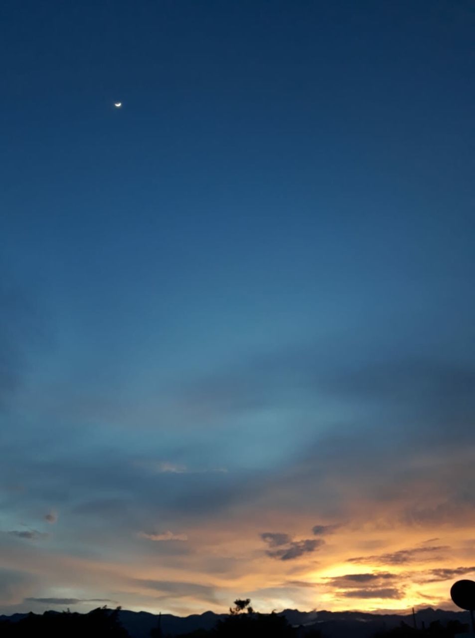 sky, cloud - sky, beauty in nature, scenics - nature, moon, tranquility, tranquil scene, sunset, no people, nature, idyllic, blue, space, outdoors, orange color, low angle view, dusk, silhouette, night, astronomy