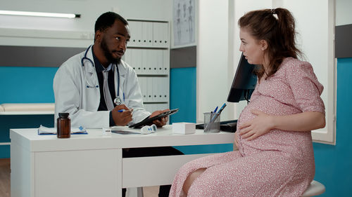 Female doctor working at clinic