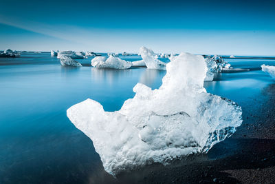 Scenic view of frozen lake against sky