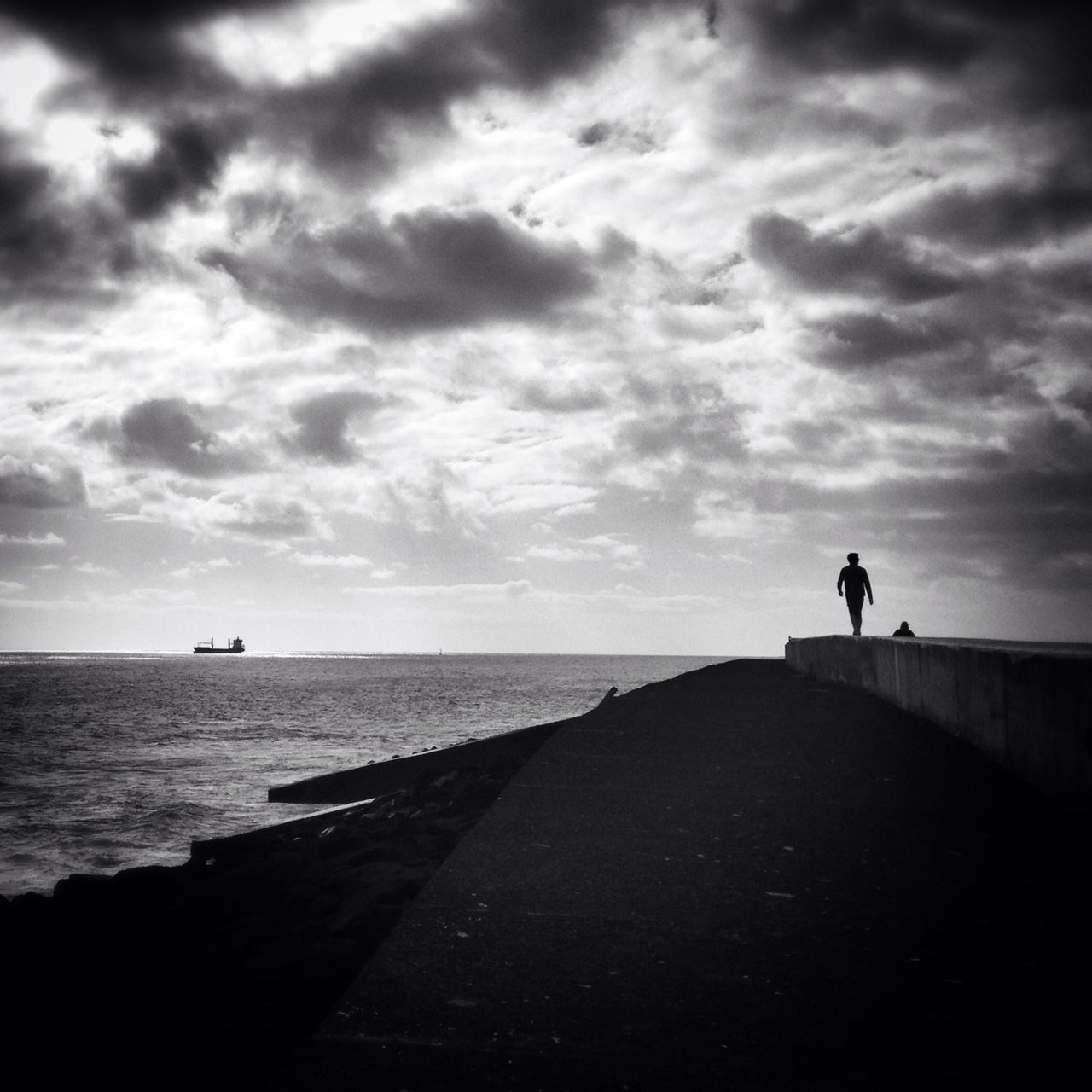 sea, sky, water, horizon over water, silhouette, men, tranquil scene, cloud - sky, tranquility, lifestyles, scenics, leisure activity, full length, the way forward, nature, beauty in nature, rear view