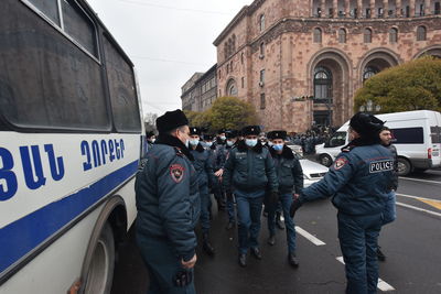 Rear view of people on street in city