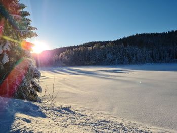 Scenic view of a frozen lake against clear sky