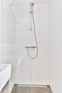 Low angle view of shower head in bathroom