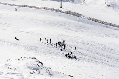 High angle view of people on snow at ski resort
