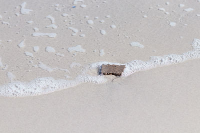 High angle view of sand on beach