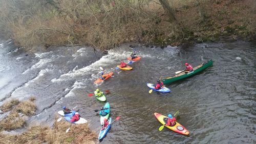 High angle view of people floating on river