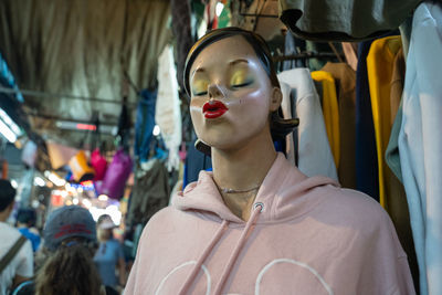 Portrait of woman standing in store